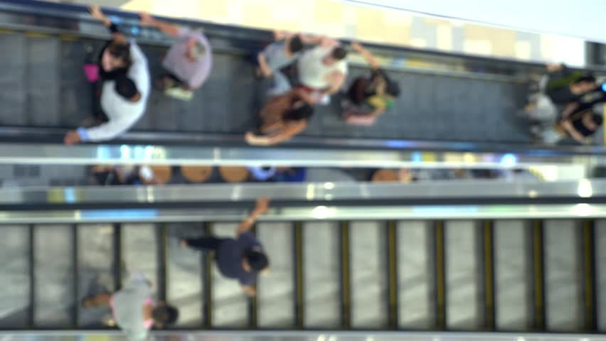Long escalators in modern mall, blur background | Shutterstock HD Video #1020940987