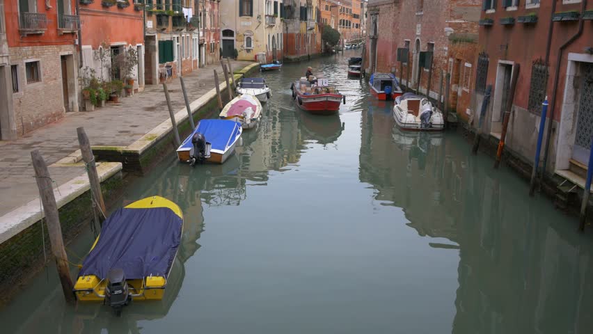 Boatman making maneuvers with his boat on the Venice Grand Canal. Venice Italy. Flat plane
