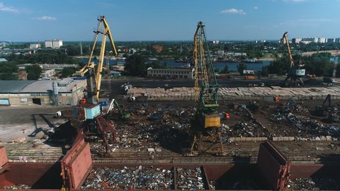 aerial view on Cranes in Sea Port. Scrap metal