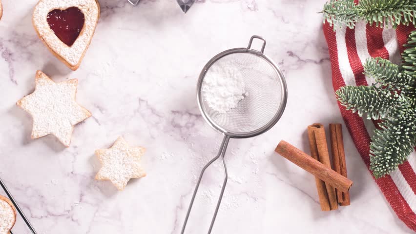 Homebaked Christmas Cookies With fruit Jam filling and Icing Sugar.