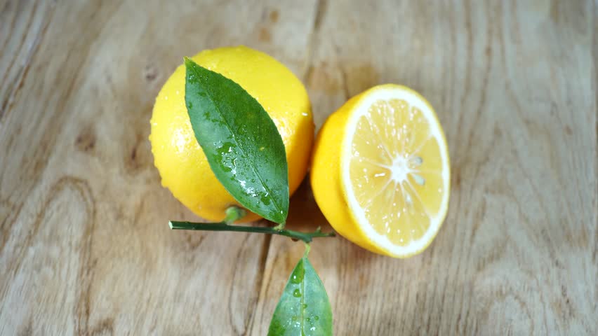 Fresh juicy chopped lemon. Organic fresh lemons containing vitamin C. 4K Royalty-Free Stock Footage #1020983584