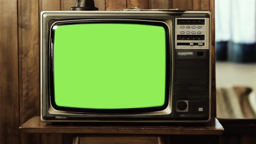 Vintage Television Set with Green Chroma Screen in a Living Room with Wooden Wall. Closeup. Zoom In.  | Shutterstock HD Video #1020986203