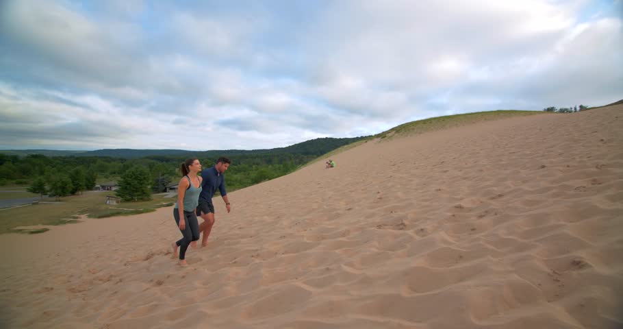 Couple Walking Up Dunes, Sleeping Bear Dunes, Michigan