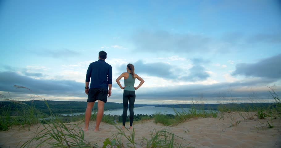 Couple Reaches the Top of Sleeping Bear Dunes, Michigan