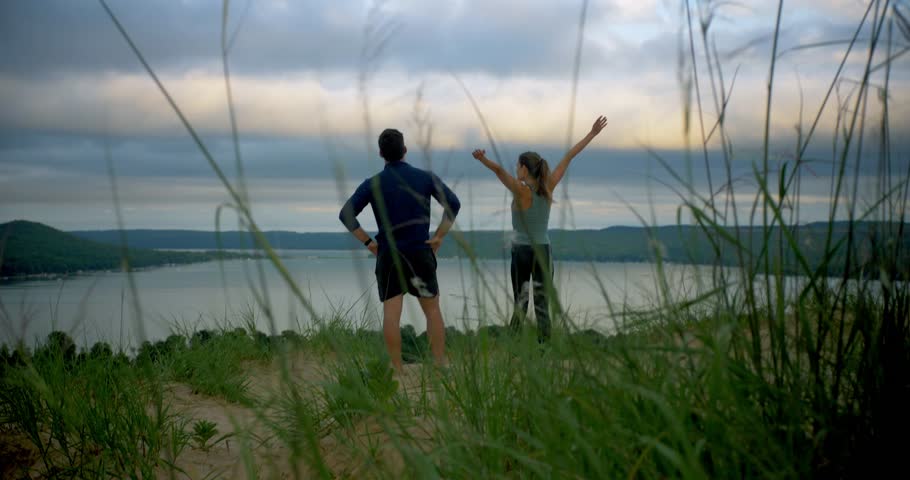 Couple Reaches the Top of Sleeping Bear Dunes, Michigan