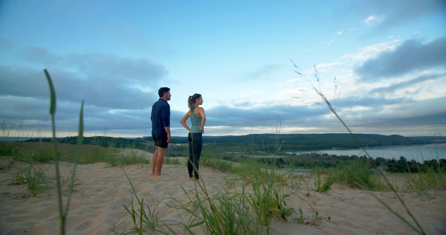 Couple Reaches the Top of Sleeping Bear Dunes, Michigan