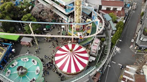 Aerial drone shot of a vintage Japanese amusement park in Tokyo