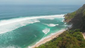 Aerial view of ocean coast and ocean with big waves. Top view