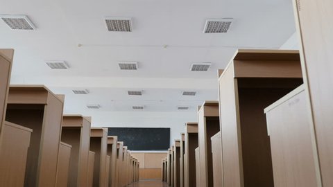 Slider View Of The Passage Between The Rows Of Desks In The Lecture Hall, Classroom.
