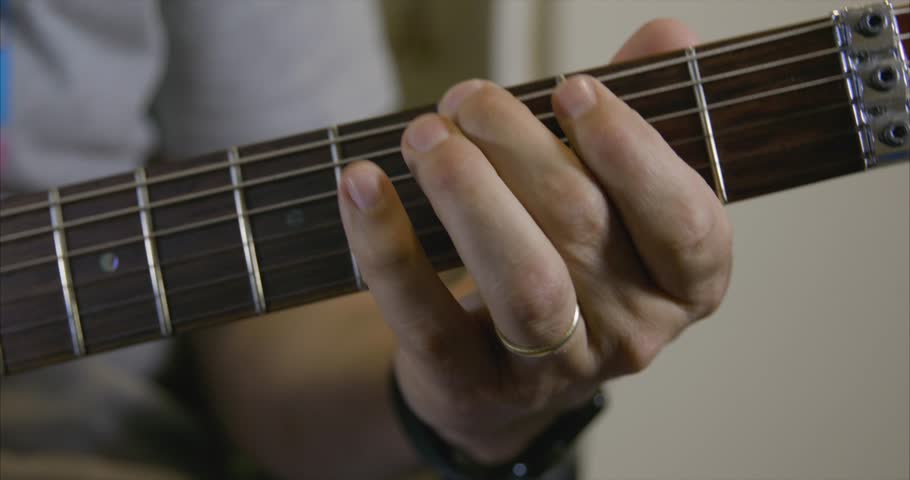 4k Close up of a male playing scale on a fretboard of a beautiful electric guitar Royalty-Free Stock Footage #1021001431