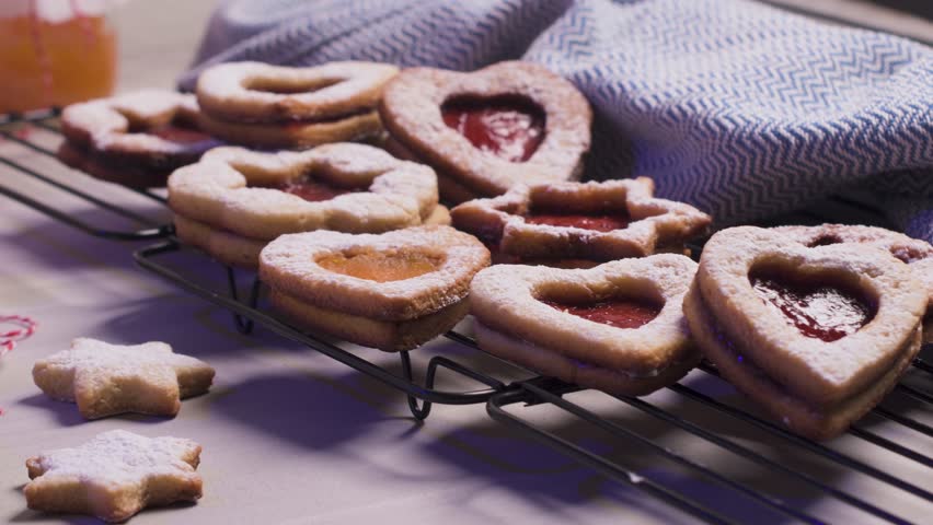 Homebaked Christmas Cookies With fruit Jam filling and Icing Sugar.