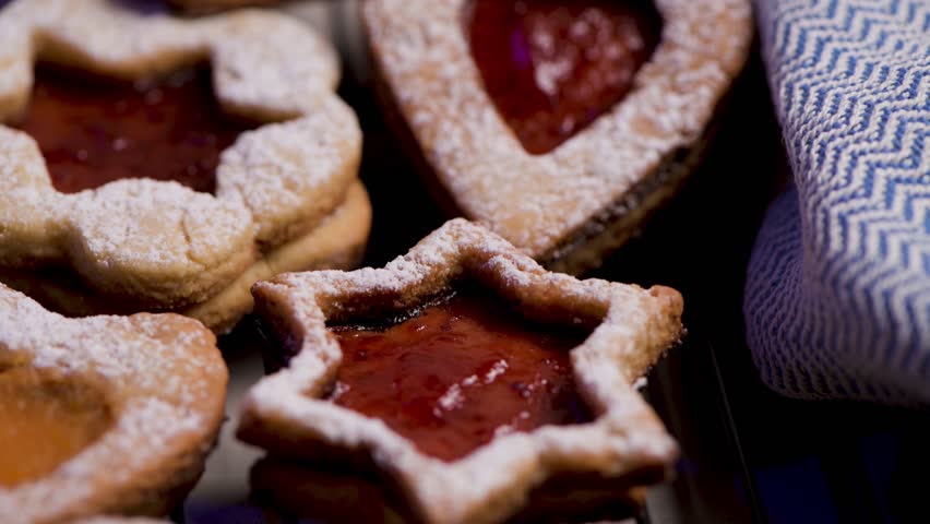 Homebaked Christmas Cookies With fruit Jam filling and Icing Sugar.