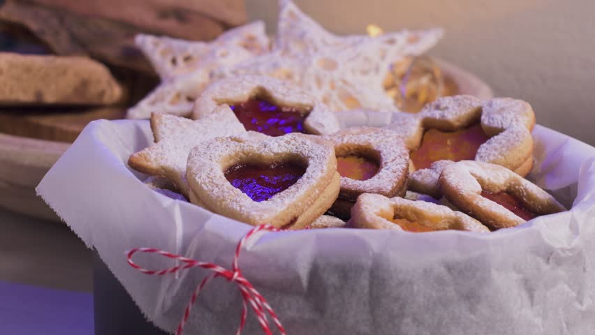 Homebaked Christmas Cookies With fruit Jam filling and Icing Sugar.