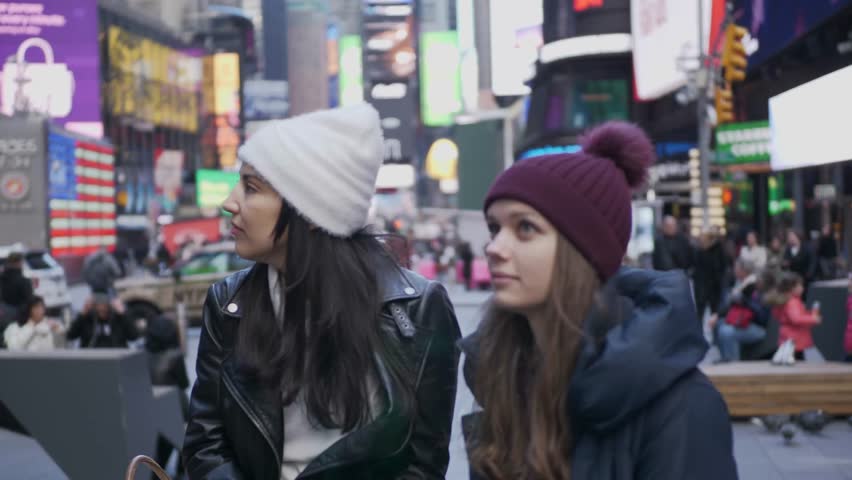 Two friends enjoy their vacation trip to New York