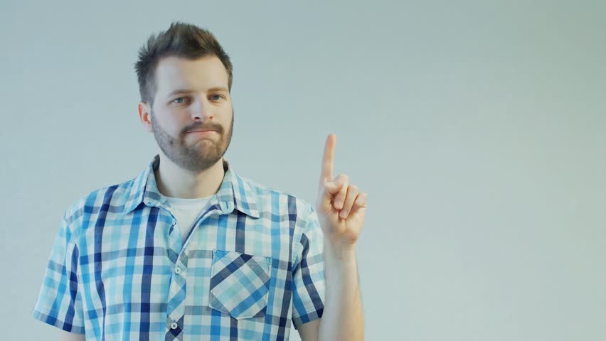 man shakes head and index finger to avoid offer, disagree or no sign, not allowed, rejection gesture, doesn't give consent, copy space Royalty-Free Stock Footage #1021010224