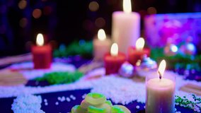Footage of decoration chritsmas with candle burning, gift and candy