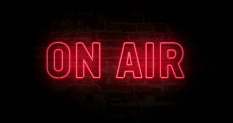 On air neon sign light on brick wall background. Glowing large text concept looping animation. Retro 1980s style.