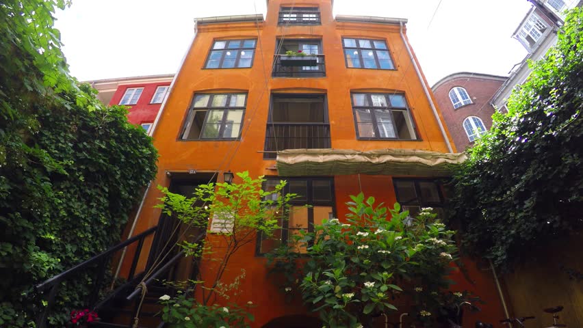 Quiet and cozy courtyard in the center of the old town. Copenhagen. Denmark. Shot in 4K (ultra-high definition (UHD)).