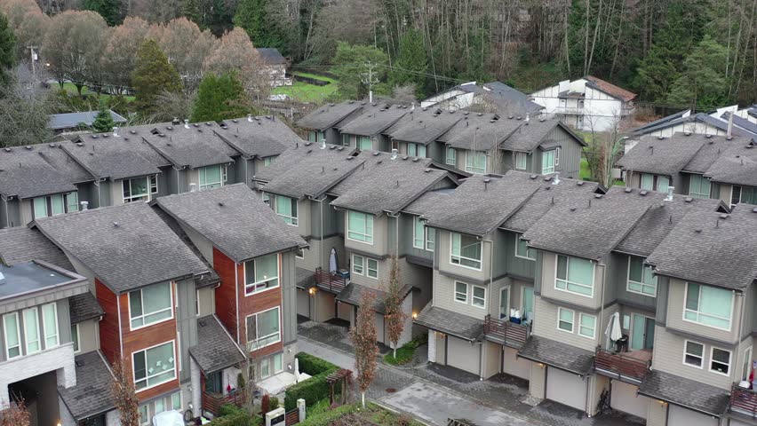 A perfect neighbourhood. Houses in suburb at Summer in the north America. Luxury houses with nice landscape. Aerial drone view.