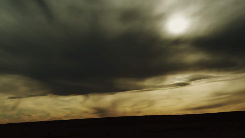 Dramatic and Mysterious early Evening Cloud Formations over the rolling hills and Horizon of the Kansas Great Plains