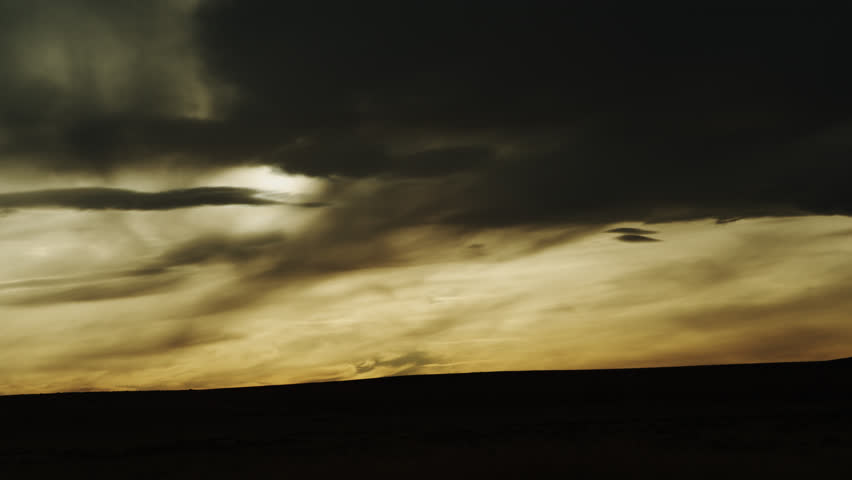Dramatic and eerily Mysterious Evening Cloud Formations over the rolling hills and Horizon of the Kansas Great Plains