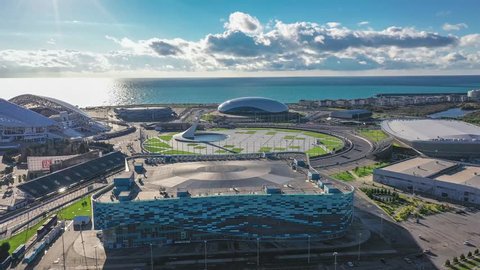 Sochi Adler, Russia - December 14, 2018 Panoramic view from the quadrocopter to the Sochi Olympic Park. Aerial. Blue skies, football stadium Fisht, the ice Palace Hockey, iceberg, square medal Plaza.