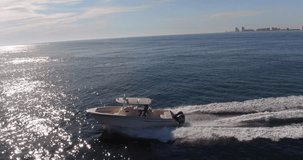 Drone aerial video of yachts and fishing boats off the coast of the Gulf of Mexico at sunset