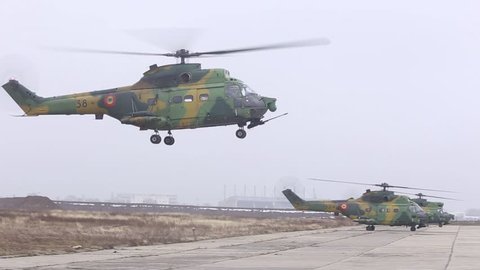 BUCHAREST, ROMANIA - November 24, 2018: IAR 330 Puma military helicopter of Romanian Air Force prepares to take off on a foggy late autumn day