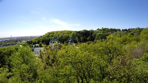 Aerial view the M. M. Hryshko National Botanical Garden in Kiev. The garden has many coniferous trees, honey locusts, peonies, roses, magnolias, bushes, lilacs.The Vydubychi Monastery