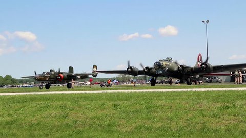 CHESTERFIELD, MISSOURI / USA - MAY 14, 2016: World War II era bombers, B-17 Flying Fortress and B-25 Mitchell, warm up at the 2016 Spirit of St. Louis Air Show & STEM Expo.