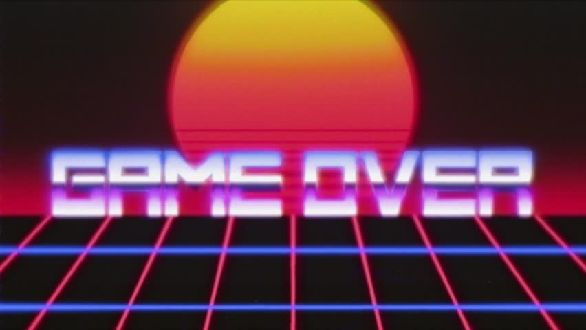 VHS tape screen capture: a retro futuristic animation of a twilight sun appearing on a grid moving forward, with the text Game Over.
