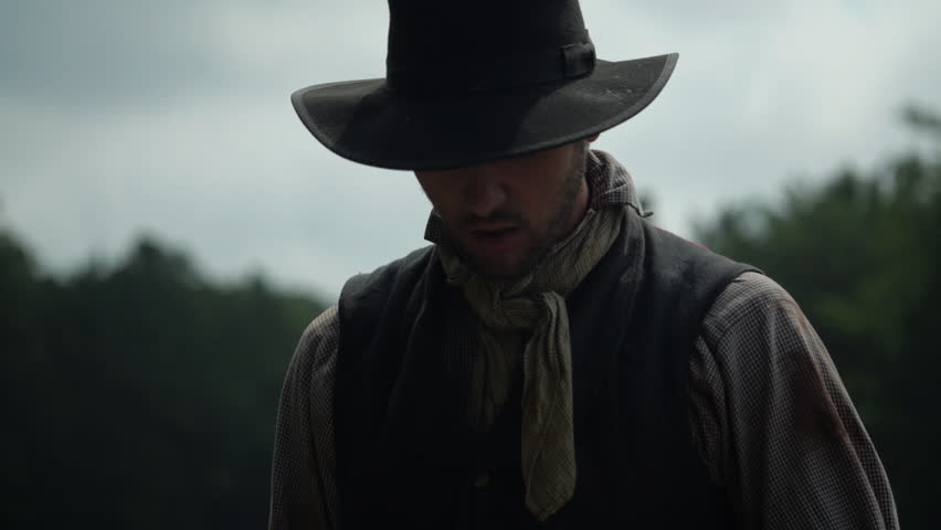 Man swinging tool - digging and building railroad - mid-19th century. 1800s Western Transcontinental Railroad construction. Re-enactment recreation of California Gold Rush era. Laboring in the sun.
