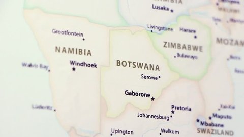 Botswana on a political map of the world. Video defocuses showing and hiding the map.