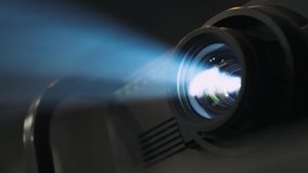 Working projector, equipment for conducting presentations, particles in a ray of light.