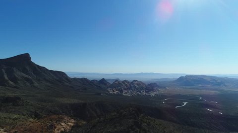 Surreal drone shot overlooking a barren desert and impressive geological rock formations