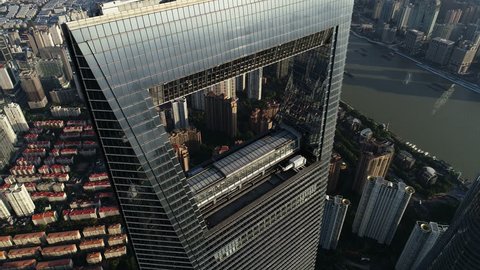 SHANGHAI, CHINA - SEPTEMBER 2018: Tilting drone footage of supertall Shanghai World Financial Center skyscraper in the central business district of Shanghai, modern architecture in urban China