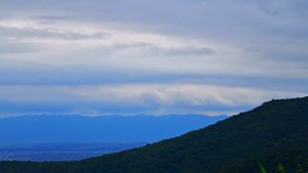 4K time lapse video of mountain with clouds flowing at Phayao province, Thailand.