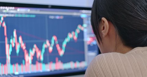 Woman study the stock market data