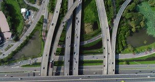 Aerial view, top down view of traffic jam on a car bridge and moving train. 4K video