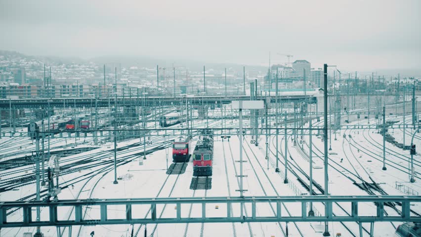 Trains and many railroad tracks in snow in Zurich, Switzerland