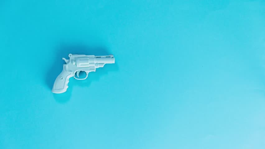 Plastic gun shoots marshmallows instead of bullets. Stop motion animation. 
