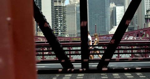 Couple Walks Across Old Chicago Bridge
