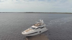Drone aerial video of yachts and fishing boats off the coast of the Gulf of Mexico at sunset