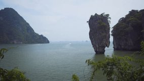 Dramatic limestone formation jutting from sea - James Bond Island. in Thailand