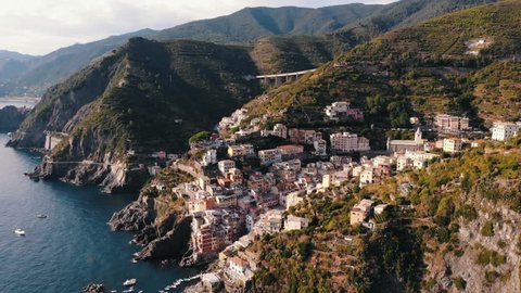 4K aerial shot: panorama of the Riomaggiore city in the Cinque Terre (five towns), Italy.