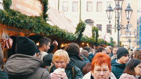 Nuremberg, Germany - December 1, 2018: A crowd of people walking between the stalls on Christmas market. Nuremberg's world-famous Christmas market