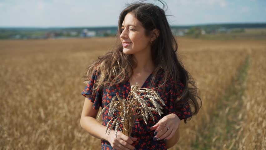 Portrait of young girl in summer field.