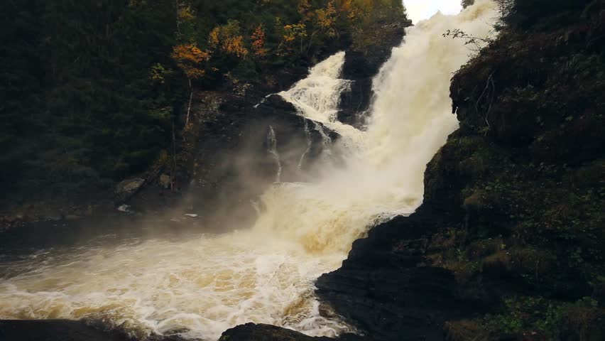 Close view on Dolanfossen waterfall with high water level. Flooding river Homla after big rain falls. Hommelvik area in middle Norway.