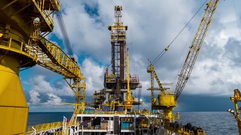 Time-lapse of derrick of Tender Assisted Drilling Oil Rig (Barge Oil Rig) on The Production Platform
