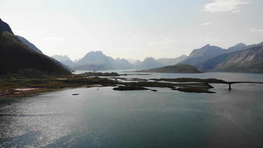 Aerial view. Norwegian scenic landscape on Lofoten archipelago. Road and bridge connecting the islands over the sea. National tourist route 10 Norway
